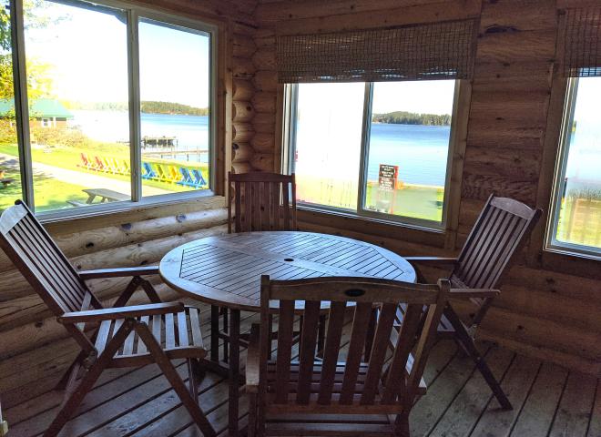 Three season porch with seating that overlooks the beach.