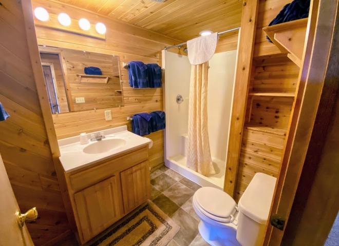 Bathroom with an oversized shower stall.