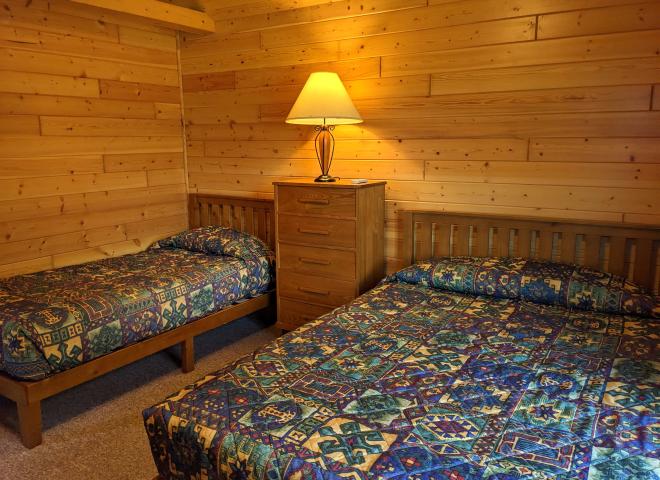 Bedroom with a queen and twin bed.