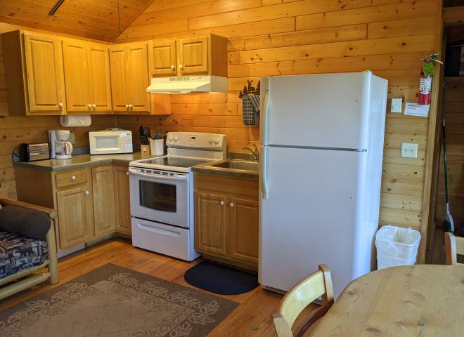 Kitchen with a refrigerator and stove.