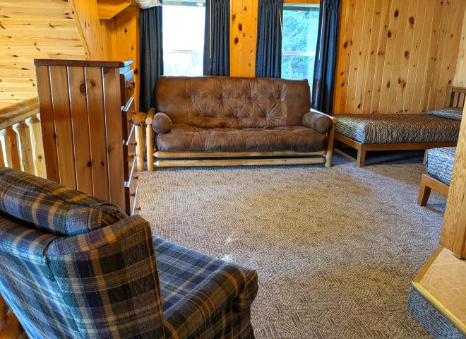Loft bedroom with two twins, and a futon.