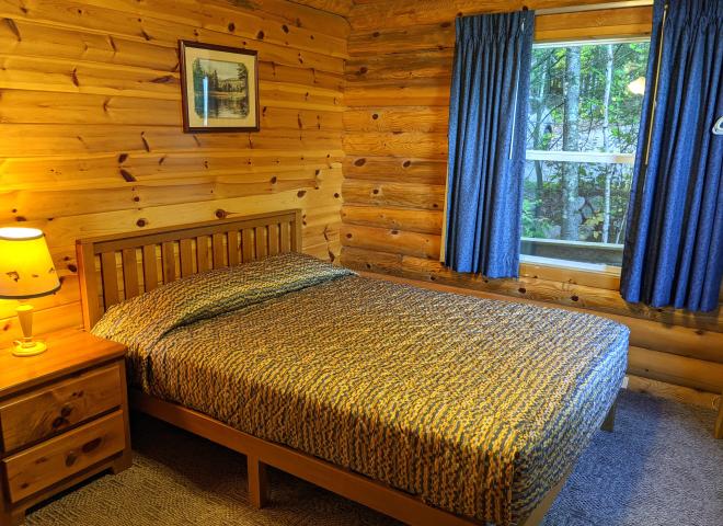 Main floor bedroom with a queen bed.