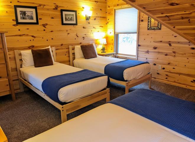 Upstairs bedroom with two XL twins and one regular twin.