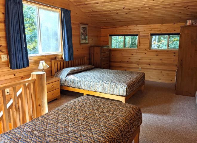Upstairs bedroom with a queen, twin, and ensuite bathroom.
