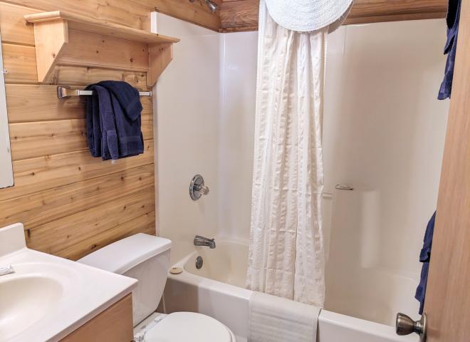 Main floor bathroom with a standard tub/shower.
