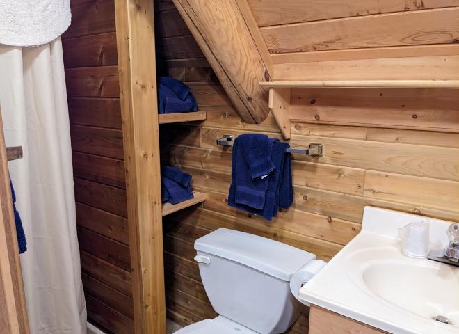 Loft bathroom with a shower stall.