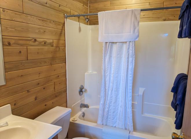 Main floor bathroom with a standard tub shower.