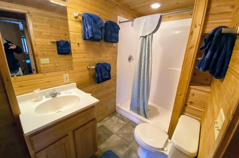 Bathroom with an oversized shower stall.