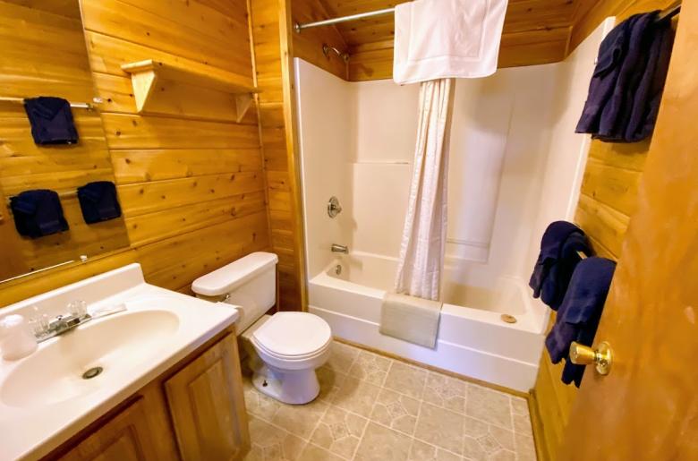 Bathroom with a standard tub/shower.