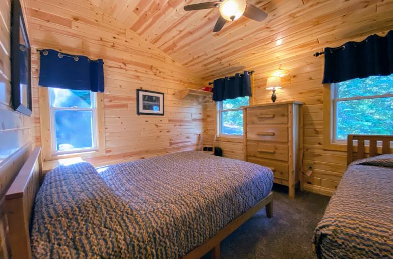 Upstairs bedroom with a queen and twin bed.