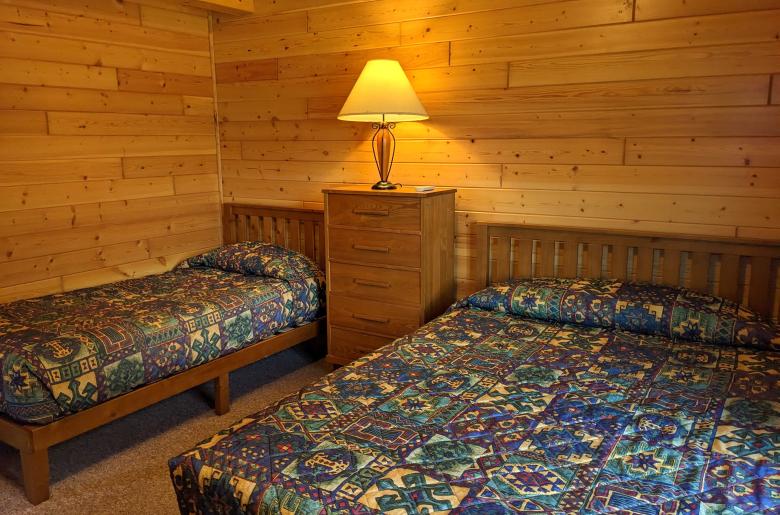 Bedroom with a queen and twin bed.