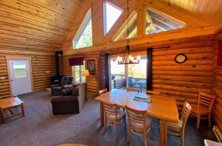 Dining area with seating and patio doors to the covered porch seating.