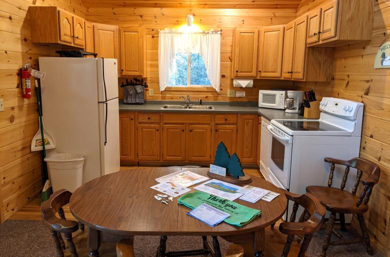 Kitchen with a refrigerator, stove, and dishwasher.