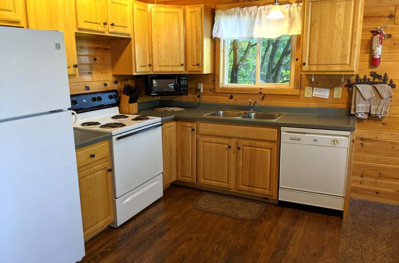 Kitchen with refrigerator, stove, and dishwasher.