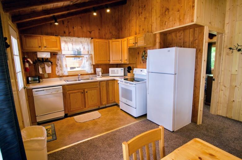 Kitchen with a refrigerator, stove, and dishwasher.