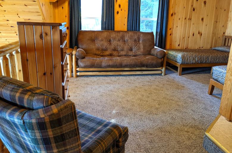 Loft bedroom with two twins, and a futon.
