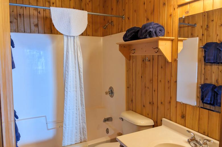 Bathroom with a standard tub/shower.