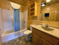 Loft bathroom with a standard tub/shower.