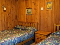 Bedroom with a full size bed and twin.