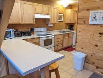Kitchen counter with seating for three.