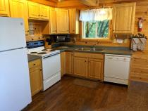 Kitchen with refrigerator, stove, and dishwasher.