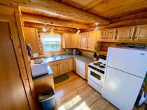 Kitchen with a refrigerator, stove, and dishwasher.