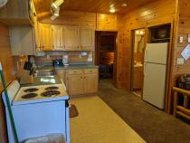 Kitchen with a refrigerator, stove, and dishwasher.