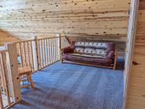 Loft area with a futon.