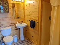 Main floor bathroom with a wide door and easy access shower and sink.
