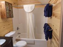 Upstairs bathroom with a standard tub/shower.