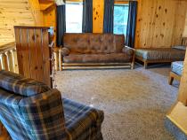 Loft bedroom with two twins, and a futon.