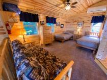 Loft bedroom with two twins and a futon.