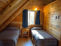 Loft bedroom with two twin beds.