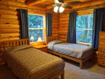 Main floor bedroom with two twin beds.
