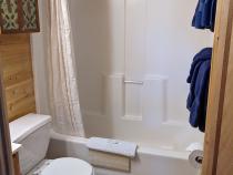 Main floor bathroom with a standard tub/shower.
