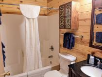 Upstairs bathroom with a standard tub/shower.