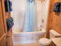 Upstairs bathroom with a standard tub/shower.
