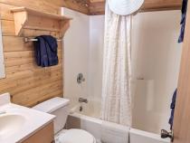 Main floor bathroom with a standard tub/shower.