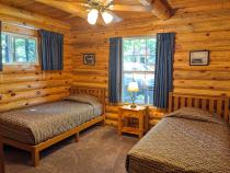 Main floor bedroom with two twin beds.