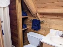 Loft bathroom with a shower stall.