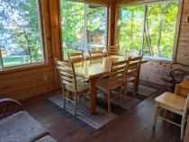 Dining room with extra seating and views of the lake.