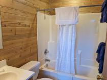 Main floor bathroom with a standard tub shower.