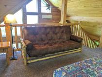 Loft area with a futon.